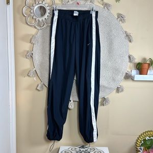 Navy blue Nike windbreaker pants
